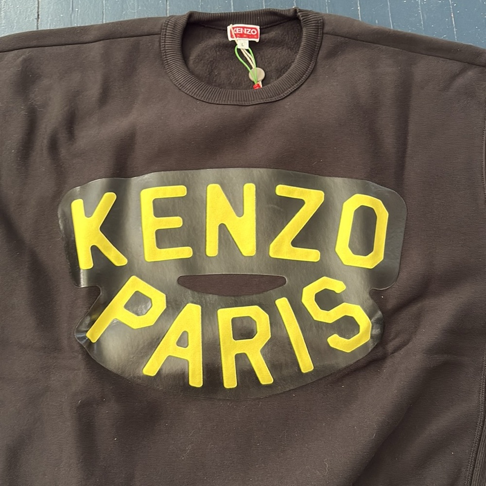 Kenzo black sweatshirt with yellow logo on front and elephant head on the back